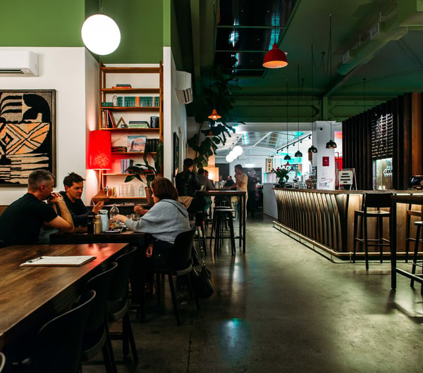 Customers dining inside the large open pace of Giant Brewing in Havelock North.