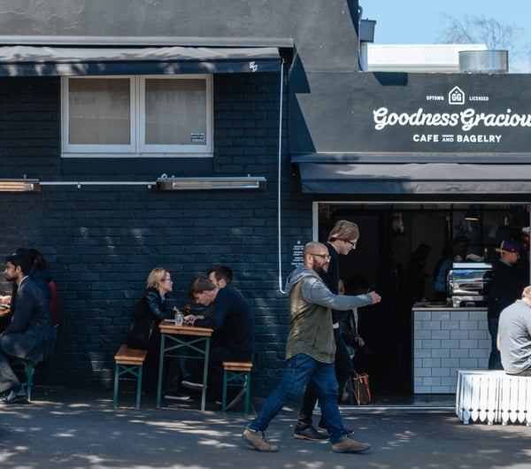 People walking past the cafe.