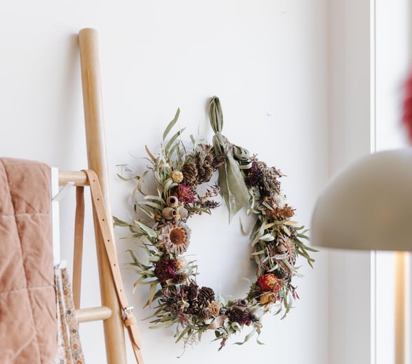 Dried flower wreath hanging on wall at Harakeke Florist in Christchurch.