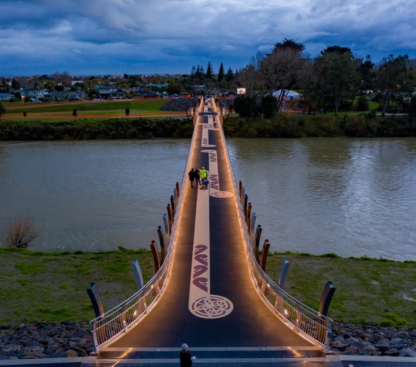 The He Ara Kotahi Bridge at night.