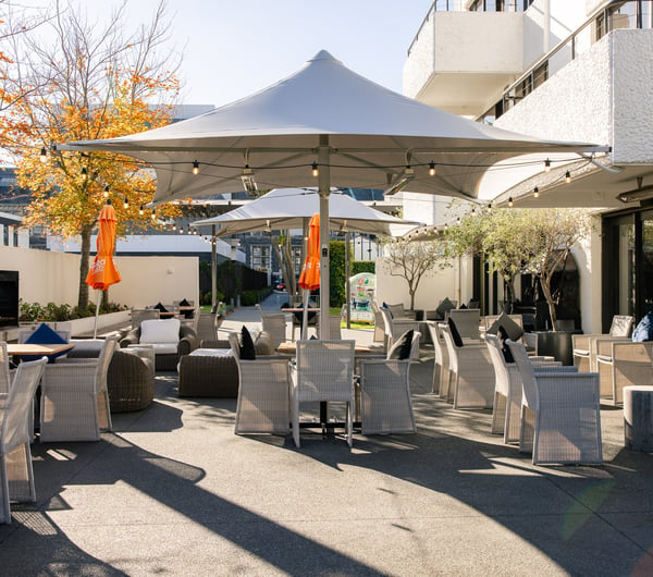 Outdoor seating at Hotel Montreal on a sunny day.