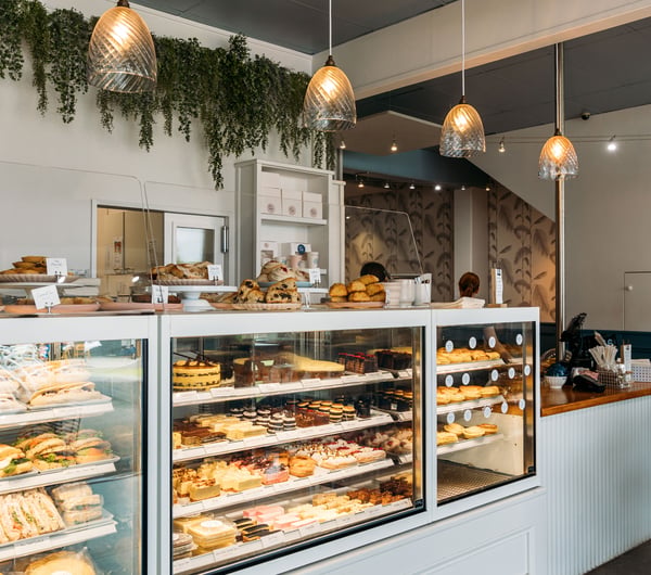 A large glass cabinet at the counter of Joe and Joy cafe.