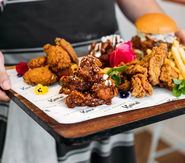 A plate of fried chickens and burgers.