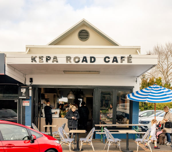 The white and blue exterior of Kepa Road Cafe.