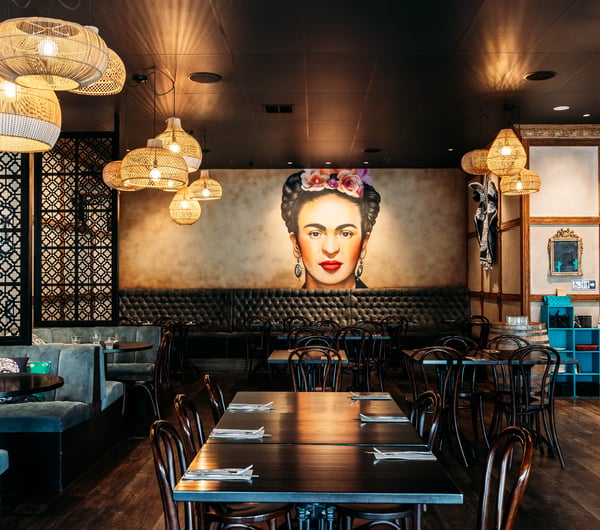 Frida Kahlo poster on the wall in the dining room of Libre.