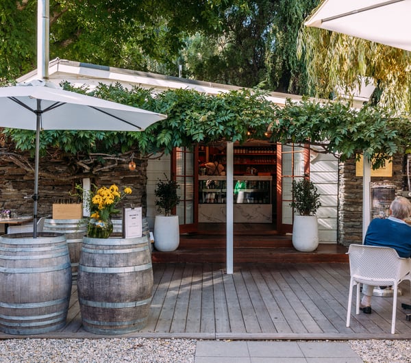 The vine covered entrance to Mora Wines Queenstown.