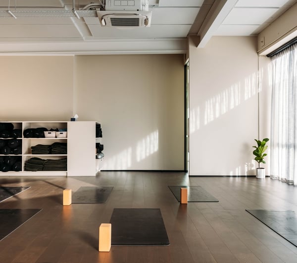 Yoga mats laid out in the studio at O-Studio.