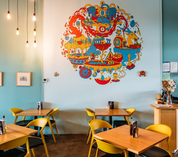 A colourful mural on the wall inside Passo.