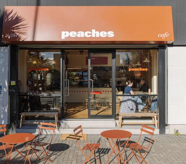 Bright orange awning of Peaches cafe.