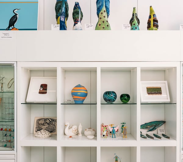 Coloured glass vases on display.