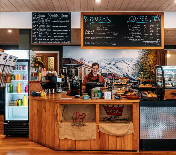 Front counter, cabinet and coffee machine at Recharge Bar & Cafe.