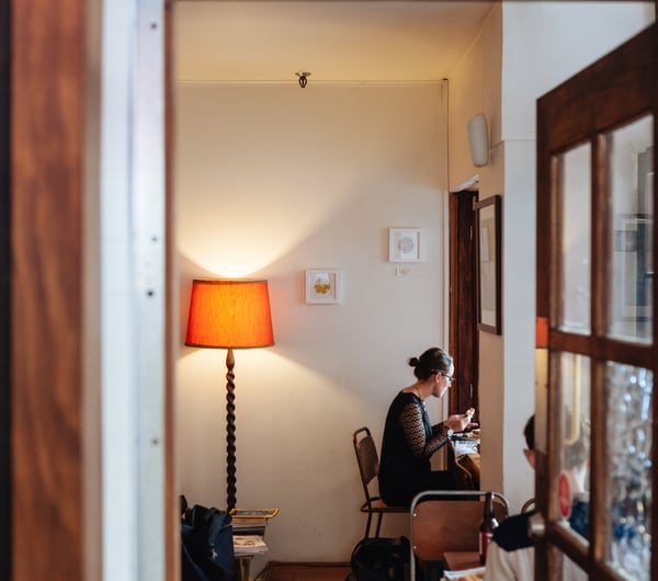 A woman eating in the cafe.