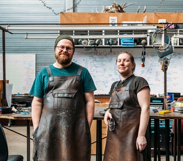 A man and woman looking at the camera.