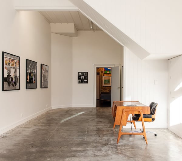 Stark gallery room with concrete floor