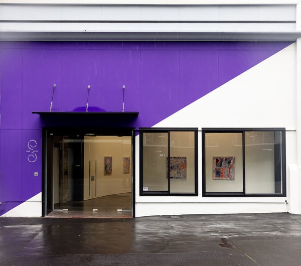 The purple and white exterior of Sumer gallery in Auckland.