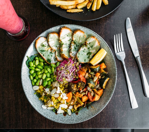 A healthy salad bowl on a table.