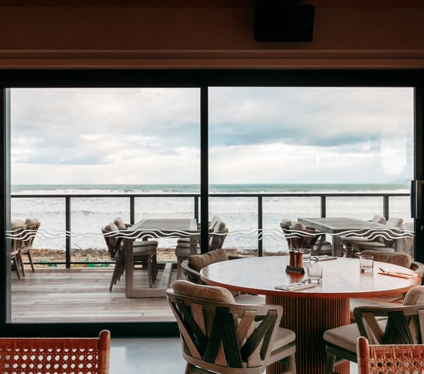 A view of the beach from inside Tahu restaurant Gisborne.