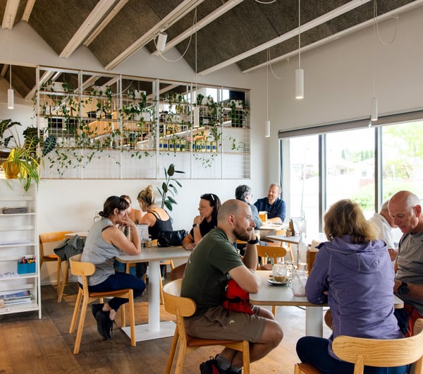 Customers sitting at tables in The Birdwood.