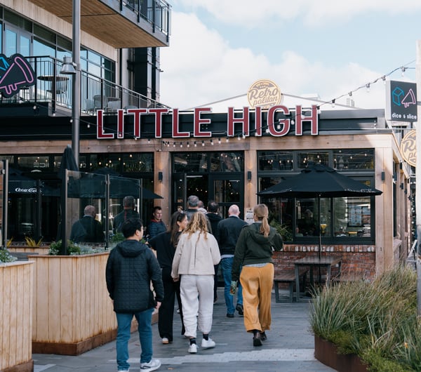 Group walking into the entrance of Little High Eatery in Christchurch