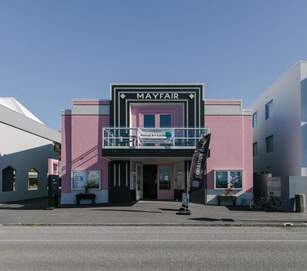 Bright pink exterior of The Mayfair.
