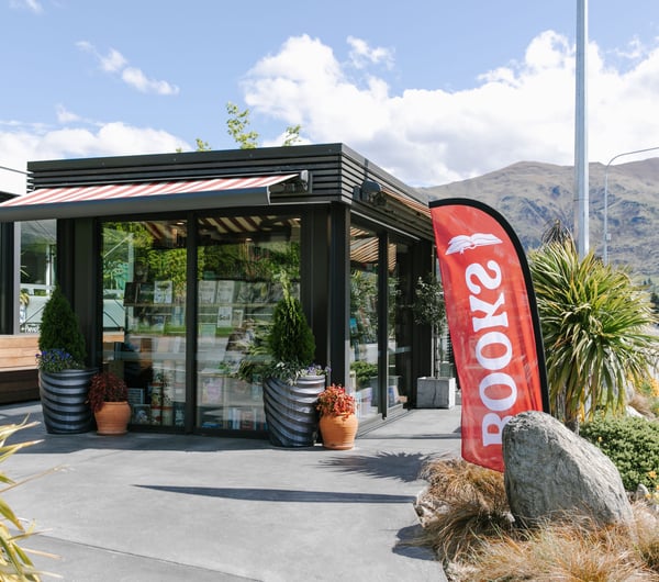 The outside of The Next Chapter, Wānaka on a sunny day.