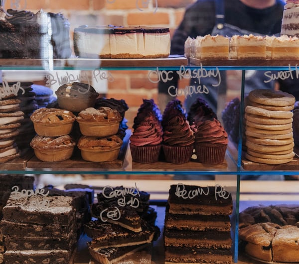 Close up of food in the glass cabinet.