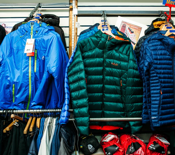 Rab puffer jackets on racks at Trek 'n' Travel, Hamilton.