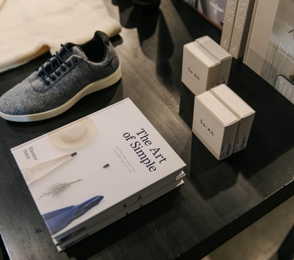Close up of shoes and book on display.