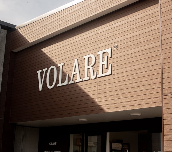 Signage on the building's exterior at Volare Bread.