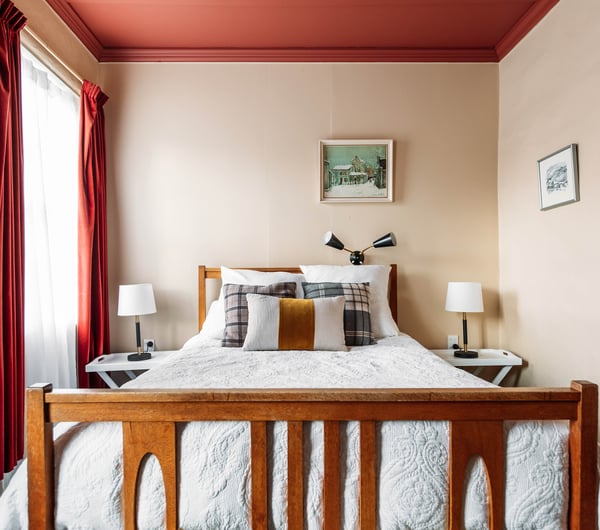 A bed in a hotel room.