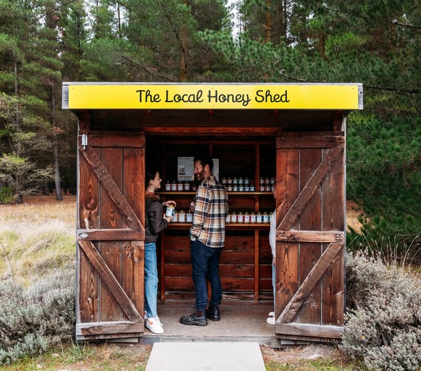 Two customers inside the roadside stall of Forage and Gold.
