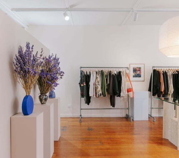 Clothing on display on racks inside Company Store Dunedin.