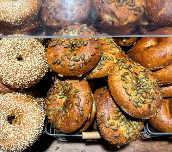 Cabinet full of bagels on display at Downtown Bagels.