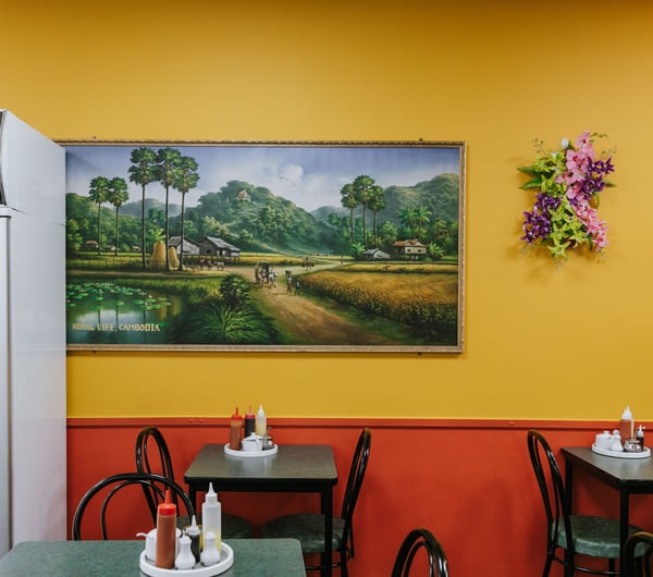 Inside Chinese Restaurant with dining table and yellow and red painted wall