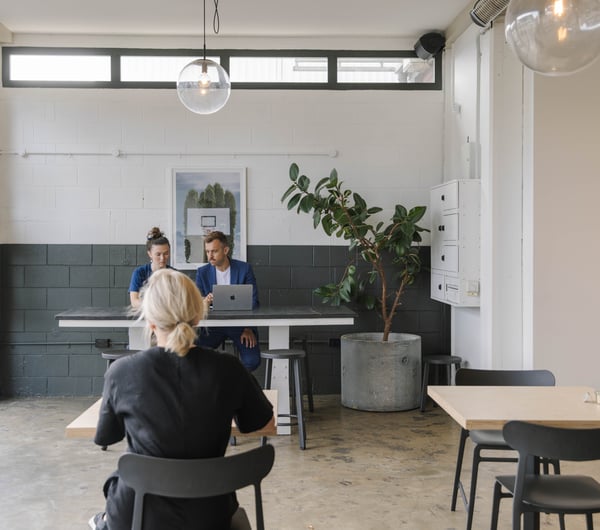 People working in a cafe.