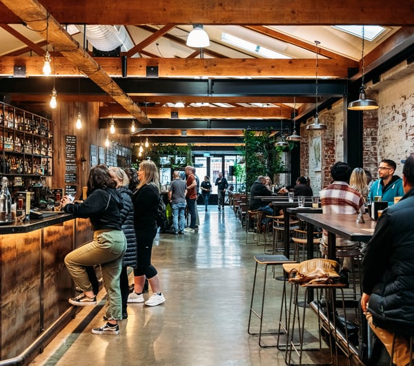Customers at the bar at Brew Union.