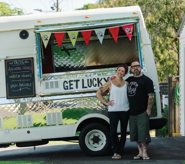 Sarah and Otis Frizzell standing in front of their fodo truck.