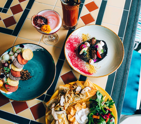 Mexican meals on colourful plates.