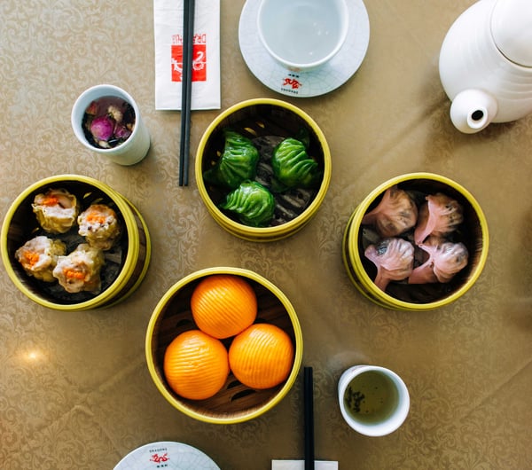 A flatlay of bowls of Chinese food at Dragons Wellington.