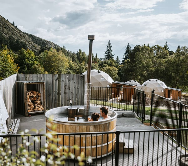 Two people in a hot tub at Cross Hill in Lake Hawea.