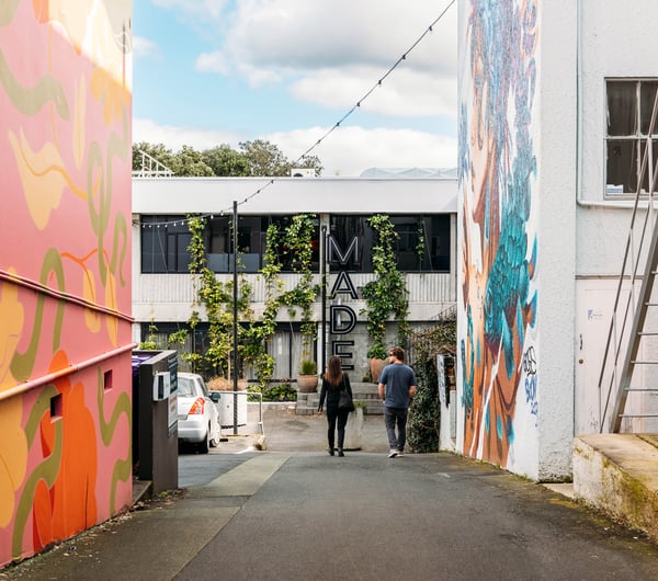Couple strolling down MADE laneway.