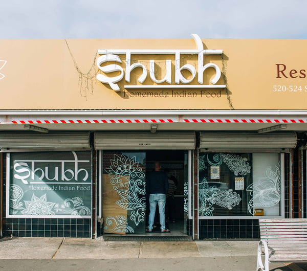 The entrance to a restaurant on a sunny day.