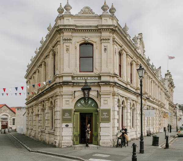 An old Oamaru stone building on a cloudy day.