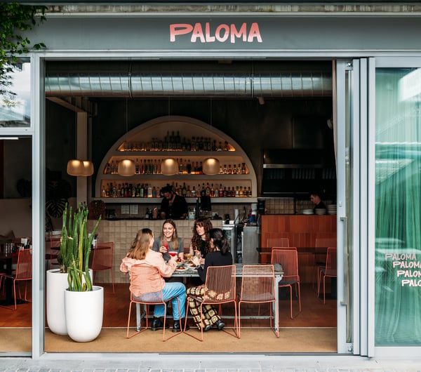 People sitting at a table at Paloma.