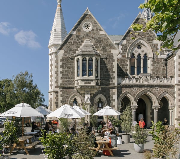 Exterior shot of the historic Arts Centre and Frances Nation Cafe in Christchurch on a hot summer's day