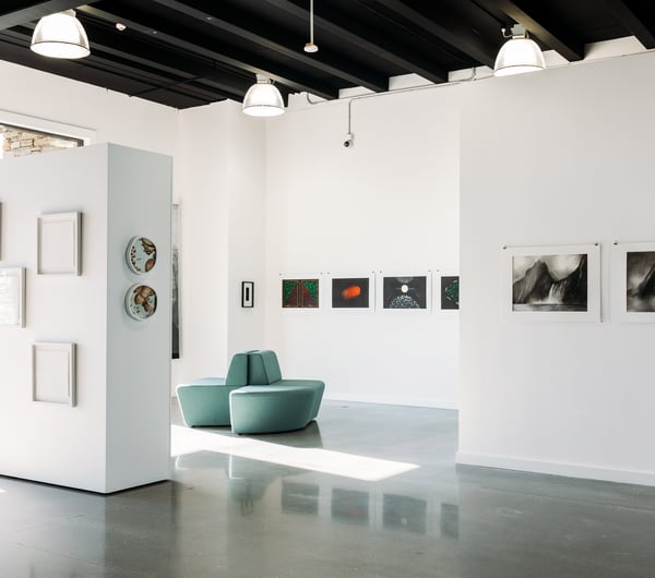 The white crisp interior of an art gallery.
