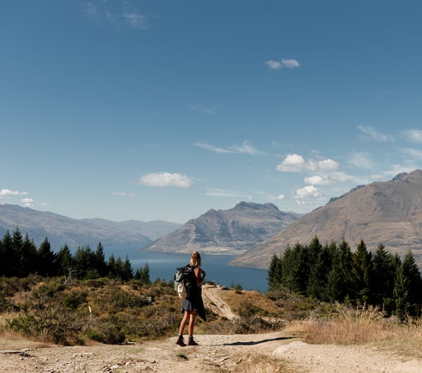 A female walker on top of Queenstown Hill.