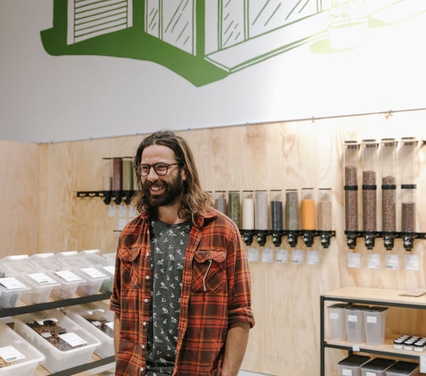 Close up of Jesse Herbert standing inside Freshlink Grocer.