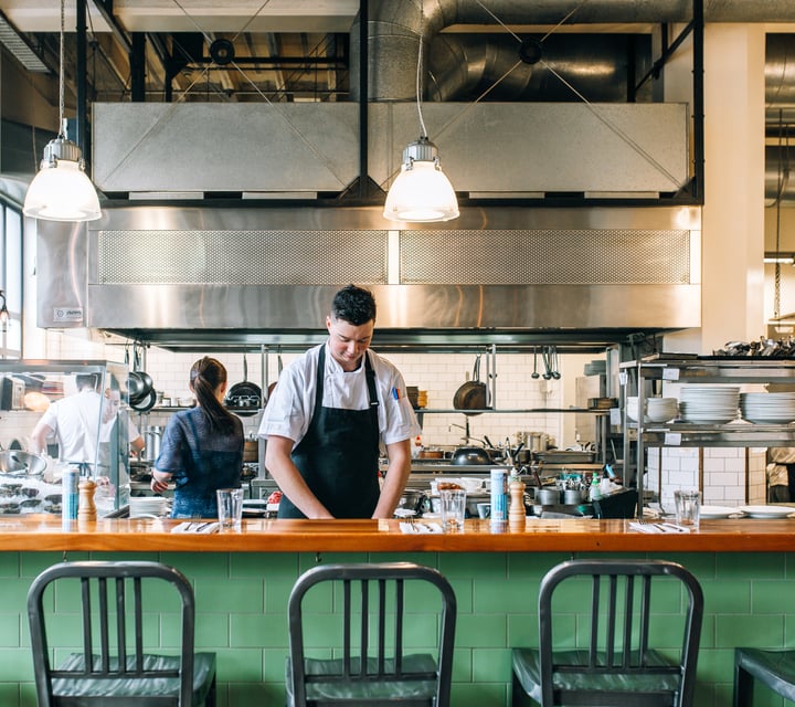 Chef at work in the kitchen at Charley Noble, Wellington.