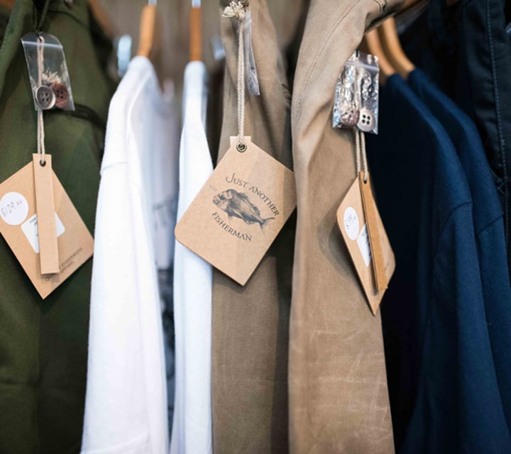 Brown Just Another Fisherman tags on clothing.